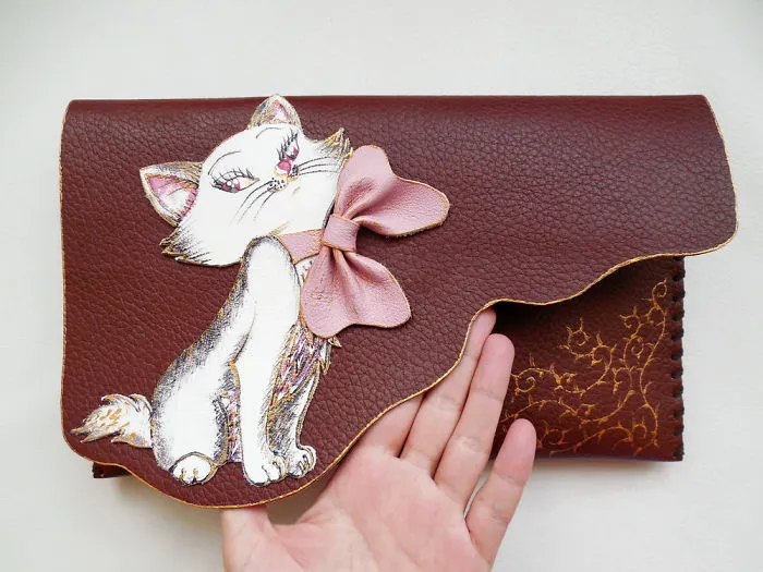I Use Hand Cut Designs And 3D Collage Techniques To Create Unique Leather Bags