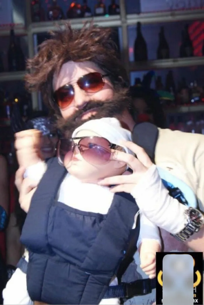 A person dressed as Alan from The Hangover holding a baby as creative Halloween costume ideas