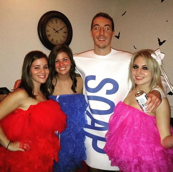 Four friends posing in a soap bar and loofahs group outfit, showing creative Halloween costume ideas.