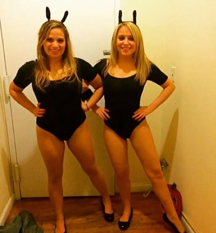 Two women dressed as dancing bunny emojis, presenting fun and creative Halloween costume ideas.