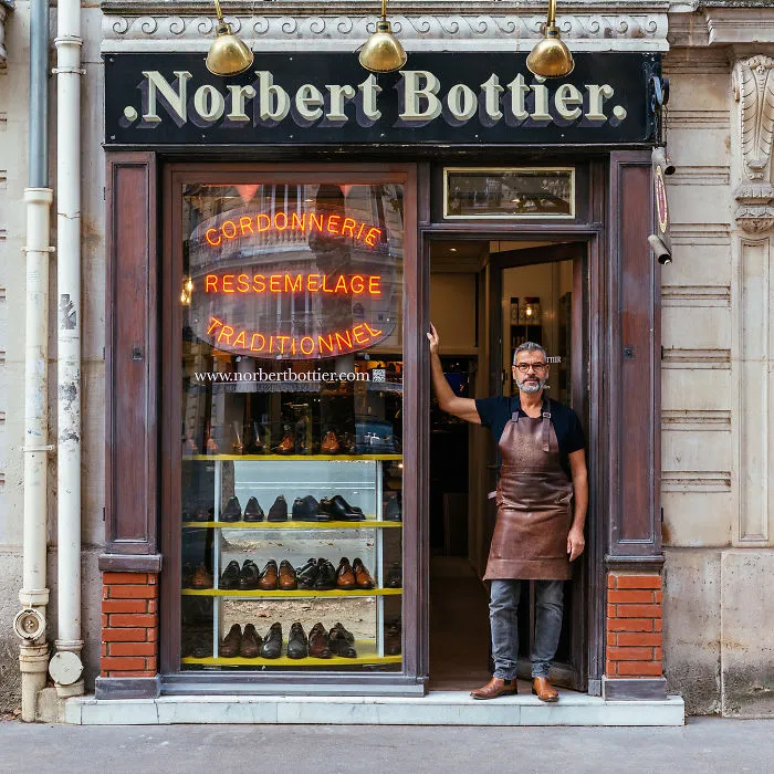 Norbert Proudly Displays The Collection Of Shoes He Designs