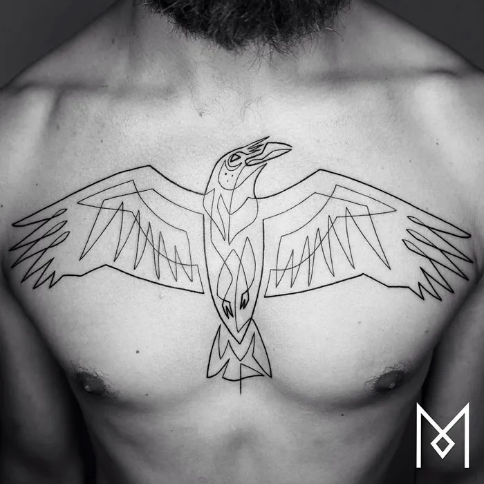 Line art of a unique small bird tattoo on a person's chest, featuring geometric wings and abstract design.