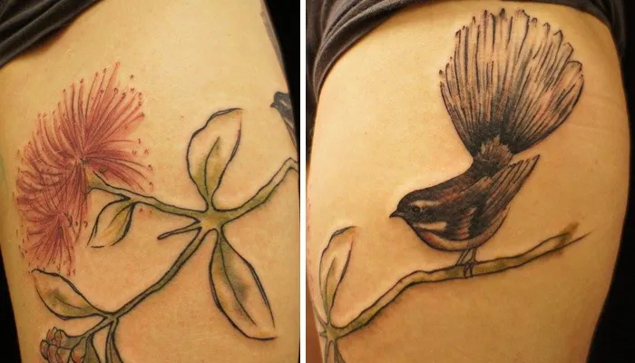 Unique small bird tattoo on arm with a botanical design, featuring a delicate branch and leaves.