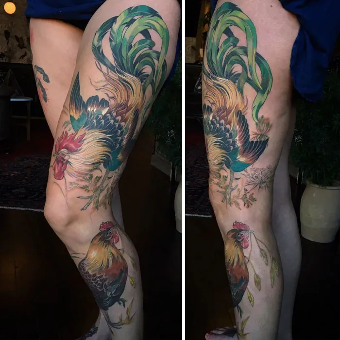 Colorful and intricate small bird tattoo on a person's leg, featuring vibrant green and red shades for inspiration.