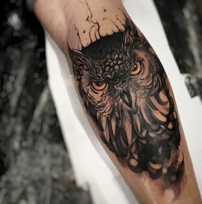 Owl tattoo art with intricate design and striking eyes, perfect for bird tattoo inspiration.