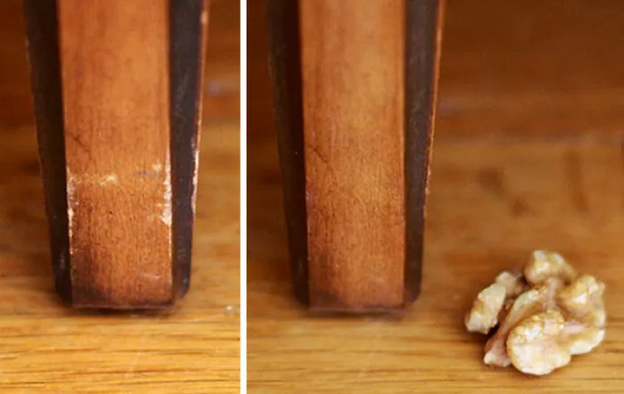Frotando una nuez en la madera dañada cubres rozaduras