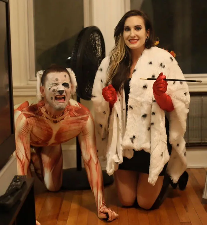 Couple dressed as Cruella de Vil and a skinned dalmatian for creative Halloween costume ideas