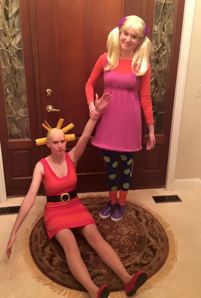 Two women dressed as Cynthia and Angelica from Rugrats for creative Halloween costume ideas