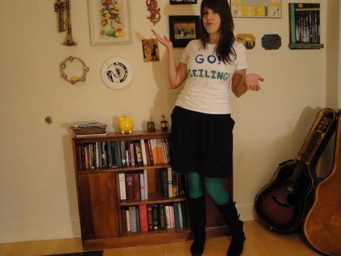Woman wearing a Go Ceiling t-shirt, illustrating a clever ceiling fan creative Halloween costume idea.