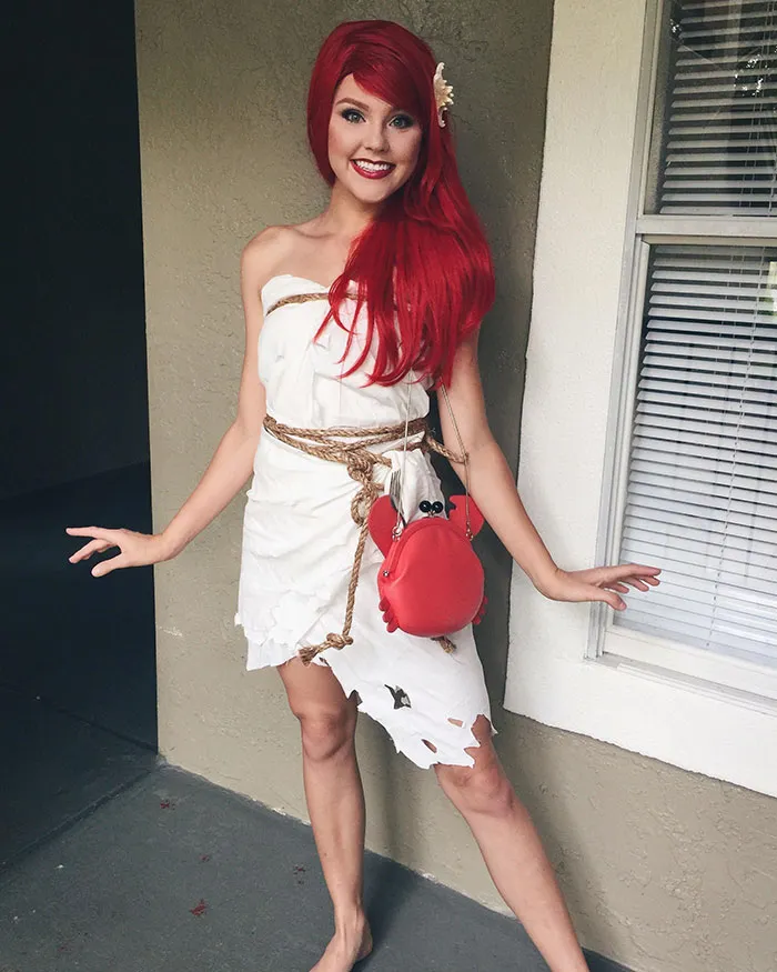 Woman dressed as Ariel wrapped in a sail as a creative Halloween costume idea