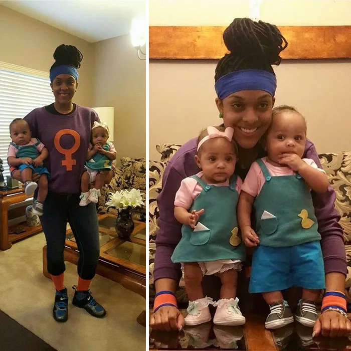 Mother dressed as a feminist holding two babies in a creative Halloween costume idea