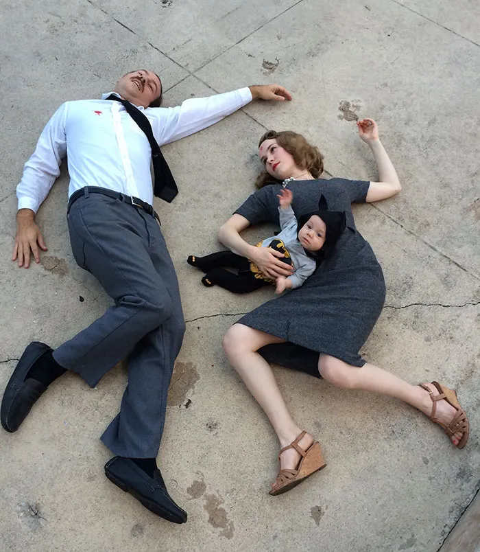 Family posing on the ground as Batman's parents as a creative Halloween costume idea