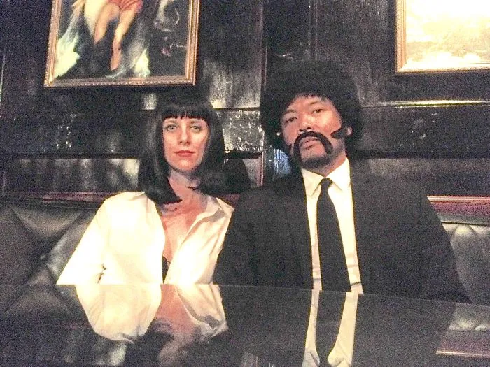 A couple dressed as Mia Wallace and Jules Winnfield for creative Halloween costume ideas.
