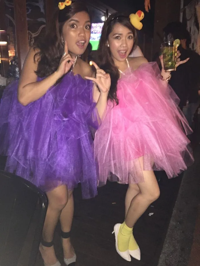 Two women wearing colorful poufy dresses for creative Halloween costume ideas