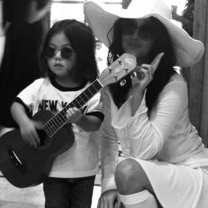 Mother and child dressed in Yoko Ono and John Lennon creative Halloween costume ideas