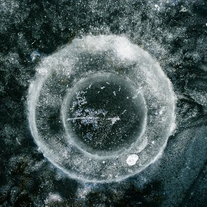 Instead Of Ice Fishing I Take Photos Of Ice Fishing Holes.