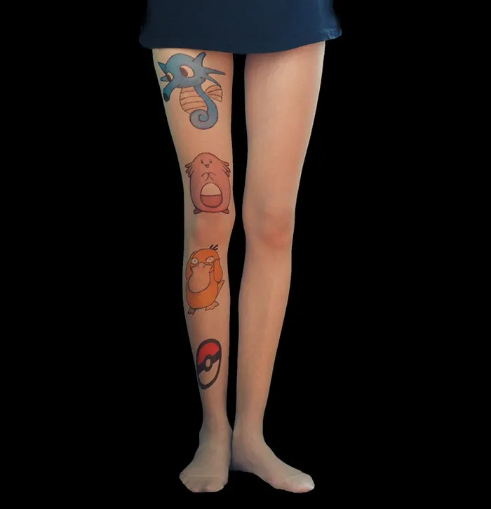 Legs wearing tattoo tights with colorful cartoon characters, creating an illusion of inked skin.