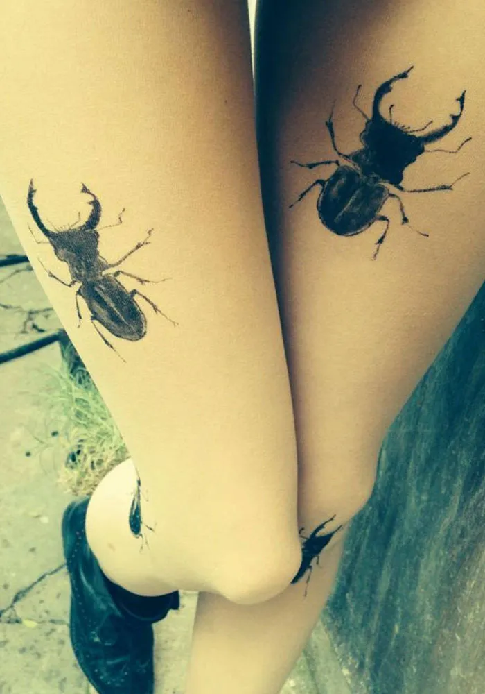 Tattoo tights with beetle designs create an illusion of inked legs.