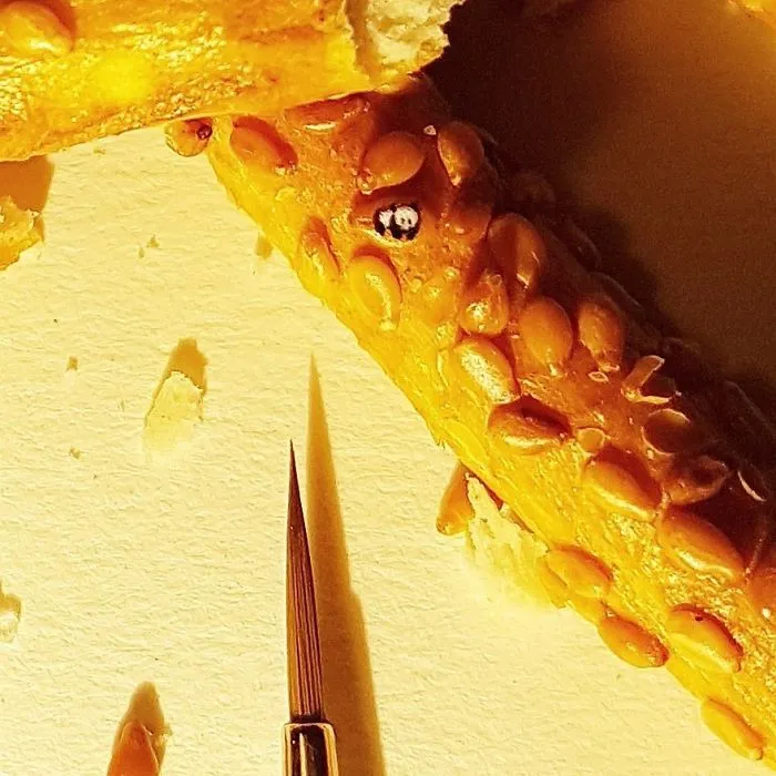Turkish Artist Paints Unbelievably Tiny Paintings Onto Small Objects