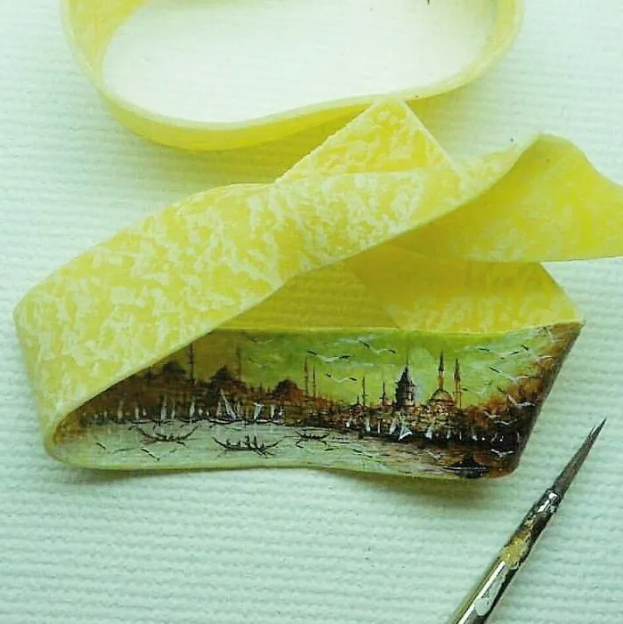 Turkish Artist Paints Unbelievably Tiny Paintings Onto Small Objects