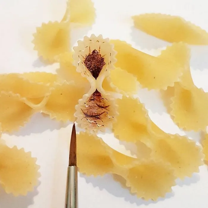 Turkish Artist Paints Unbelievably Tiny Paintings Onto Small Objects