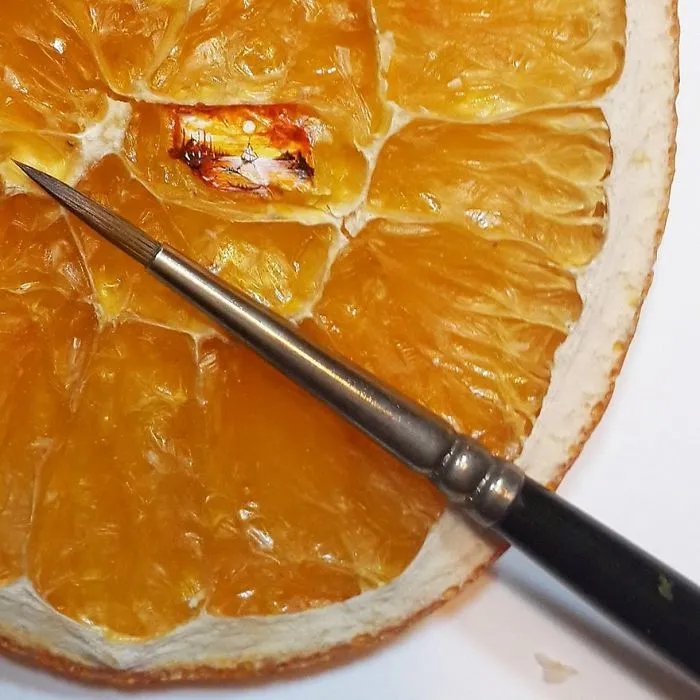 Turkish Artist Paints Unbelievably Tiny Paintings Onto Small Objects