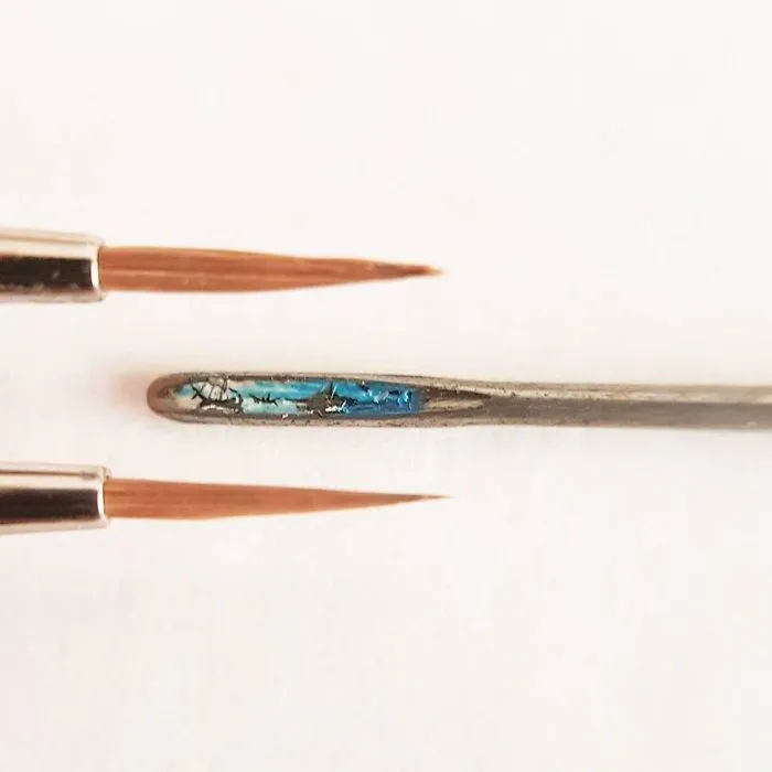 Turkish Artist Paints Unbelievably Tiny Paintings Onto Small Objects