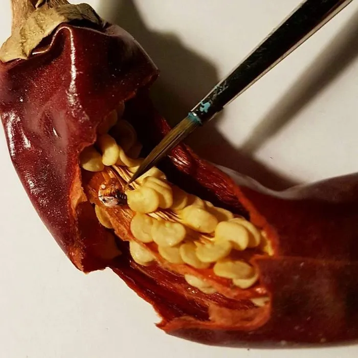 Turkish Artist Paints Unbelievably Tiny Paintings Onto Small Objects