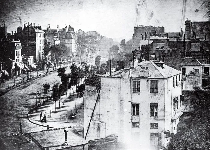 Historic photo of a Paris street, capturing early urban architecture and empty sidewalks, from the most famous photos collection.