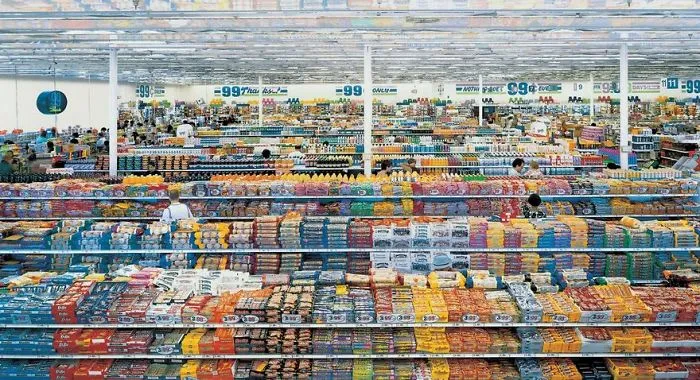 Vast supermarket aisle packed with colorful products, showcasing the variety and abundance typical of famous photos.