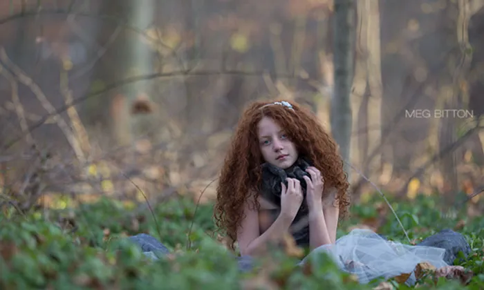 Girl with curly red hair in a forest, before Photoshop, revealing the truth behind beautiful photos.