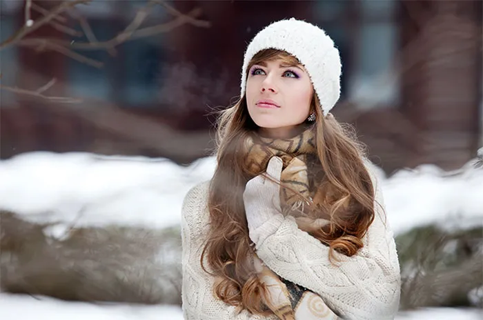 Woman in winter clothing outdoors, emphasizing Photoshop transformation results.