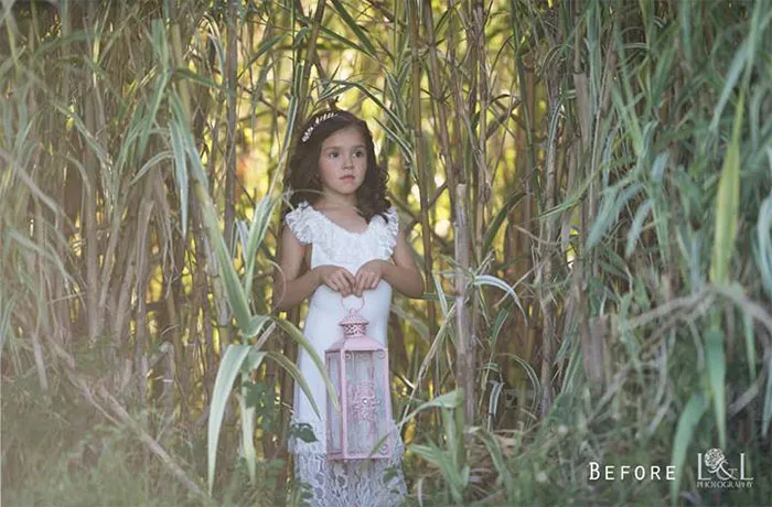 Young girl in a lush setting holding a lantern, showcasing natural beauty before Photoshop enhancements.