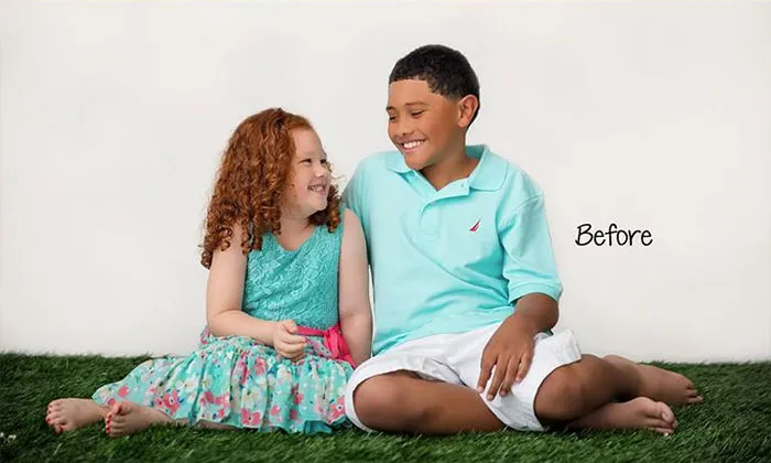 Children smiling on grass before Photoshop transformation, showcasing the truth behind beautiful photos.