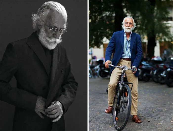 Stylish older man in a suit and glasses, posing elegantly and cycling in a blue blazer and striped shirt.