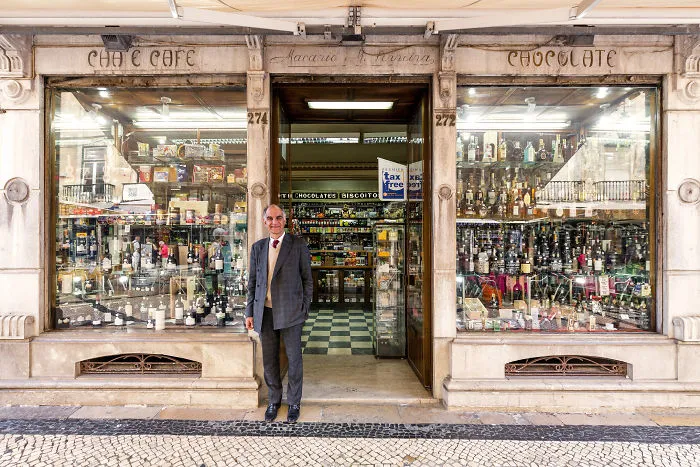 Luis Torres Receives Clients At The Entrance Of His Delicatessen