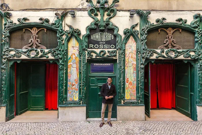 Manager José Antonio Almeida Poses At The Entrance Of His Business
