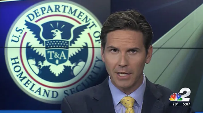 News anchor in front of altered Homeland Security seal; hidden detail emphasizes "freak you out" moment.
