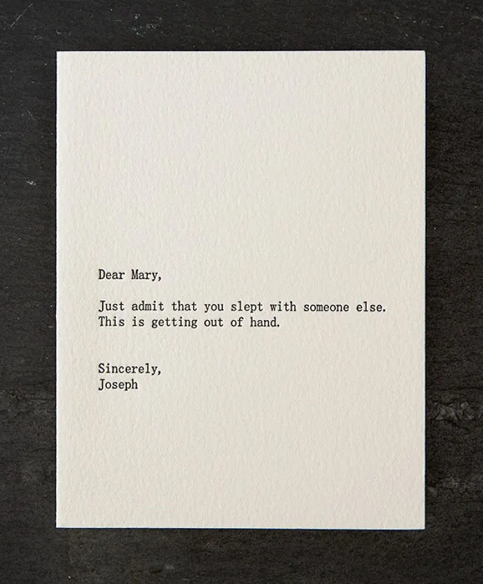 Rude Christmas card with humorous and sarcastic message in black typewriter font on white paper.