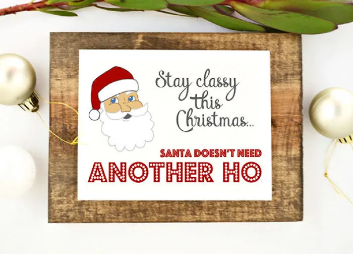 Rude Christmas card with Santa illustration, captioned "Stay classy this Christmas… Santa doesn't need another ho."