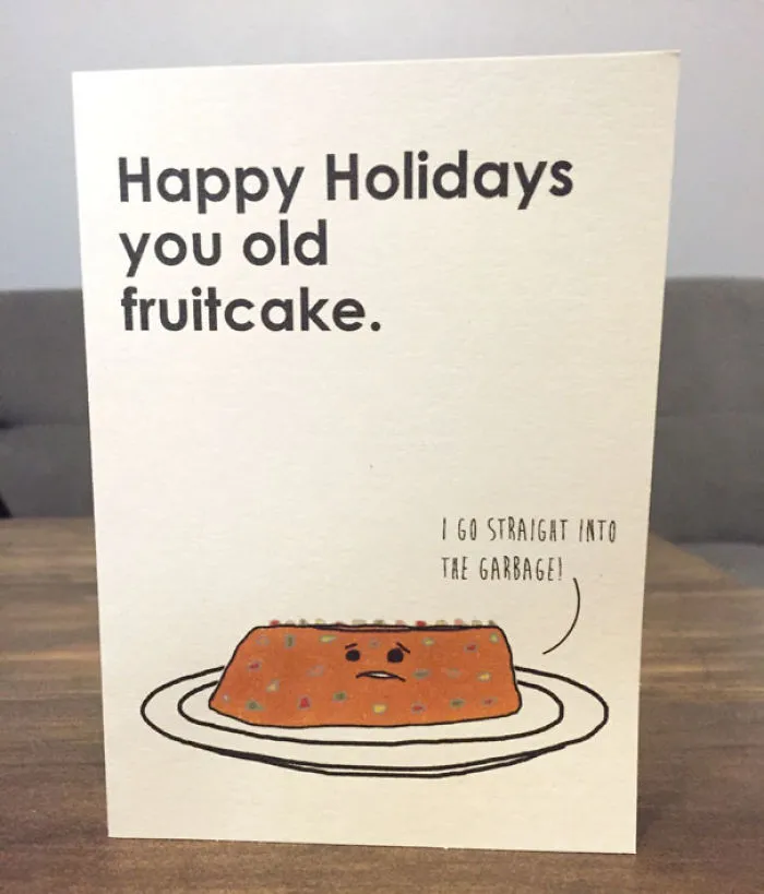 Rude Christmas card with a fruitcake illustration and humorous holiday message.