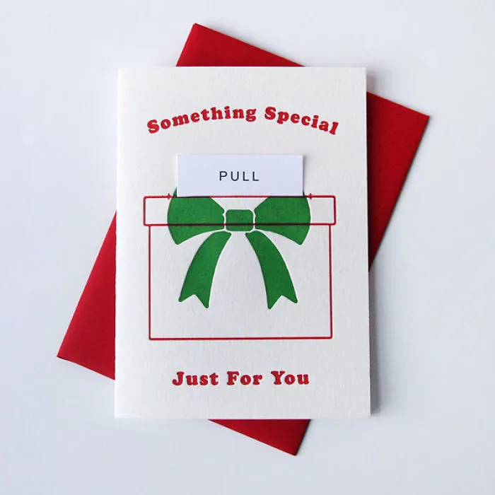 Rude Christmas card with a green bow and pull tab, labeled "Something Special."