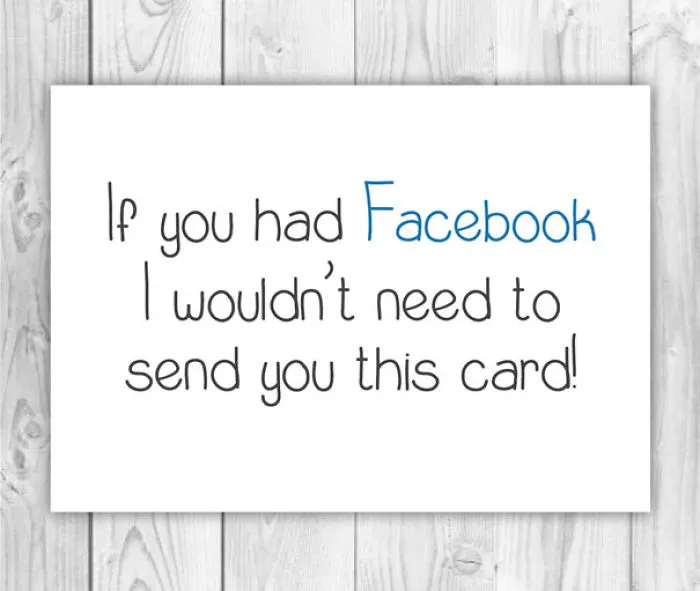 Rude Christmas card with humorous text about Facebook on a wooden background.