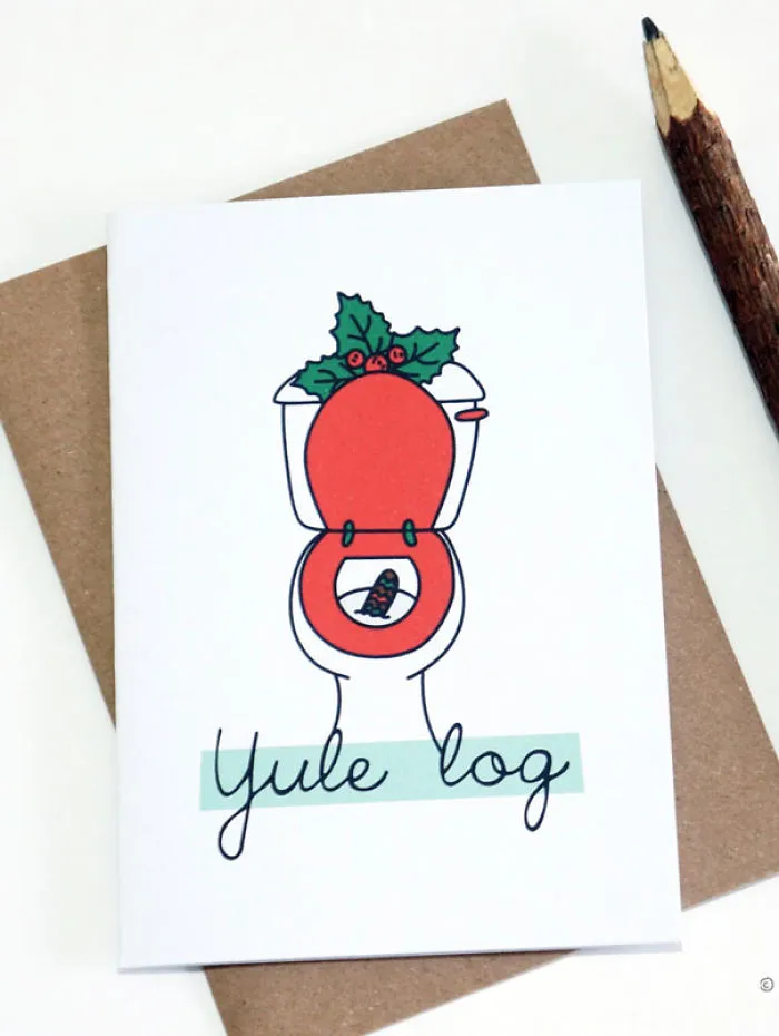 Rude Christmas card with a toilet and pun text "Yule log," for twisted holiday humor.