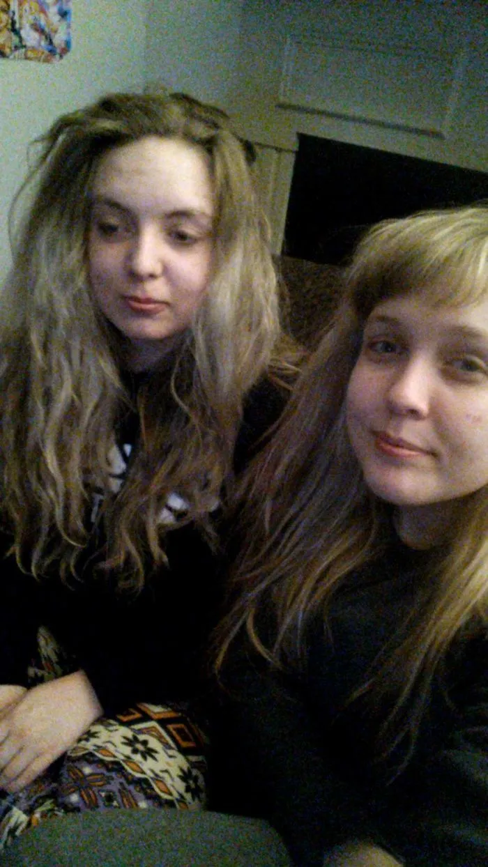 Two women with similar appearances sitting together, showcasing a doppelganger moment.
