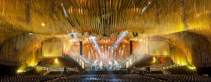 A Cave-Like Installation For The Rock Band’s Acoustic Concert Created From 74,200 Paper Tubes