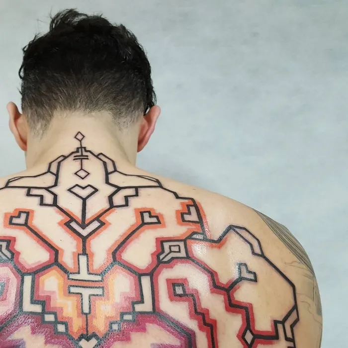 Back tattoo featuring intricate Amazonian tribal art design by Brazilian artist Brian Gomes.