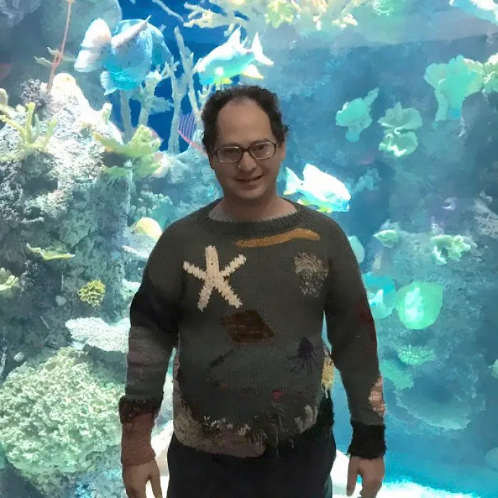 Guy Makes Sweaters Of Places And Then Photographs Himself In Those Places