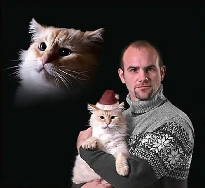 28 Awkward Vintage Photos Of Men Posing With Their Cats