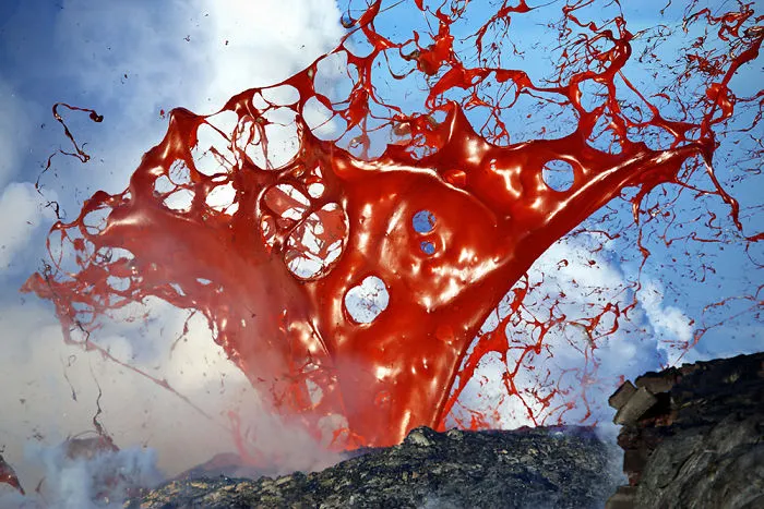 A Giant Lava Bubble Releasing Volcanic Glass In The Air